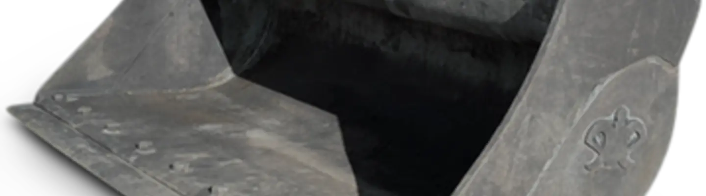 A close-up of a tilt bucket attachment on construction machinery, used for digging and grading uneven terrain.