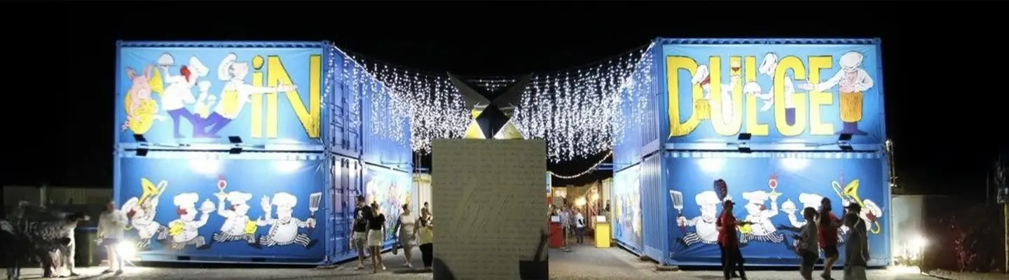Row of uniquely designed shipping container kiosks, showcasing creative and functional modular retail solutions."
