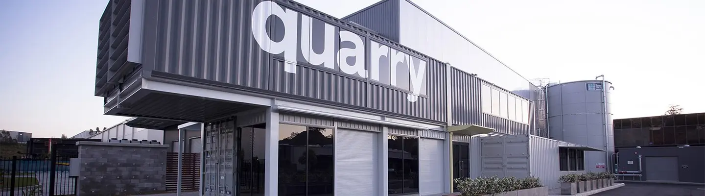 Modern commercial building constructed from stacked shipping containers.