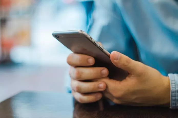 person holding iphone