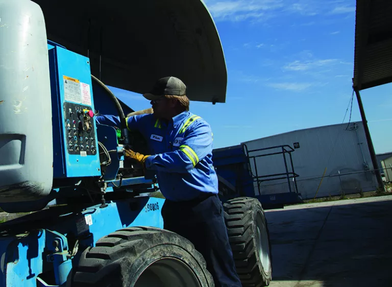 Man Working On Equipment