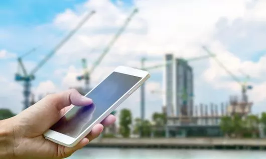 Stock image of cell phone at worksite