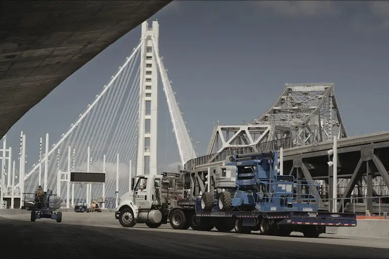 Truck hauling a boom lift