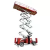 Side view of a red and silver scissor lift with extended platform.