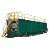 green mix tank with yellow safety rails