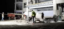 Light stand providing light on construction site
